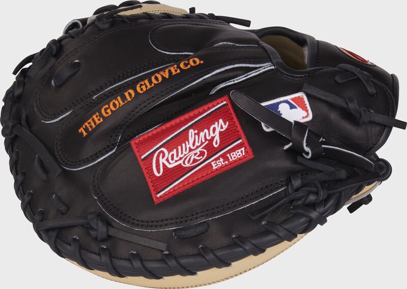 Black back of a Tucker Barnhart G57 catcher's mitt with a red Rawlings patch and MLB logo - SKU: RPROSCM33TB-RHT
