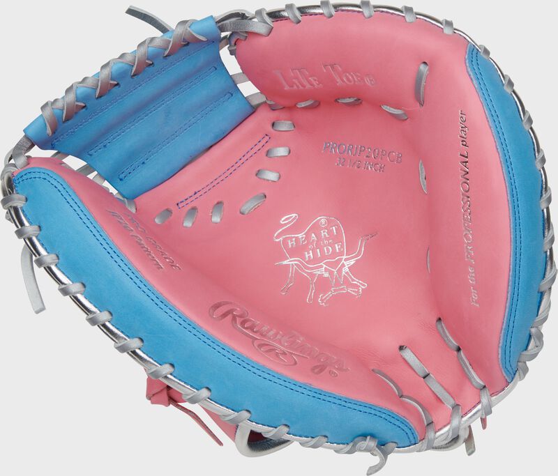 Pink palm of a Rawlings Heart of the Hide catcher's mitt with Columbia blue laces