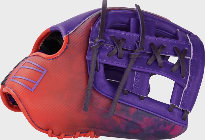 Thumb of a purple/orange Rawlings Francisco Lindor REV1X 11.75" infield glove with a purple split laced Single Post Web loading=