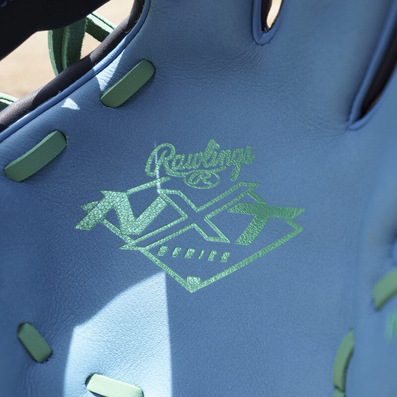 Picture of the mint Rawlings NXT Series logo stamped on the columbia blue leather palm of an exclusive Rawlings NXT Series 11.5" infield glove loading=