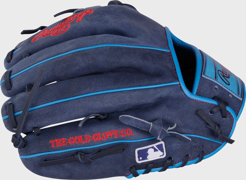 Back of a navy Heart of the Hide Pro Label denim infield glove with the MLB logo on the pinky loading=