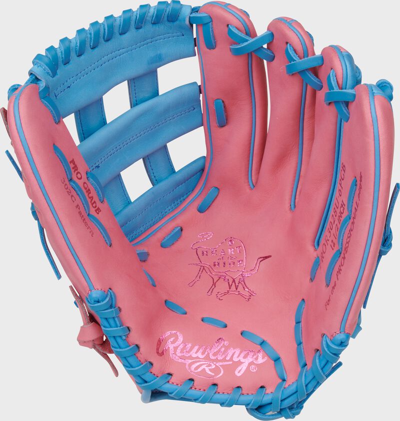 Pink palm of a Rawlings Heart of the Hide outfield glove with Columbia blue laces
