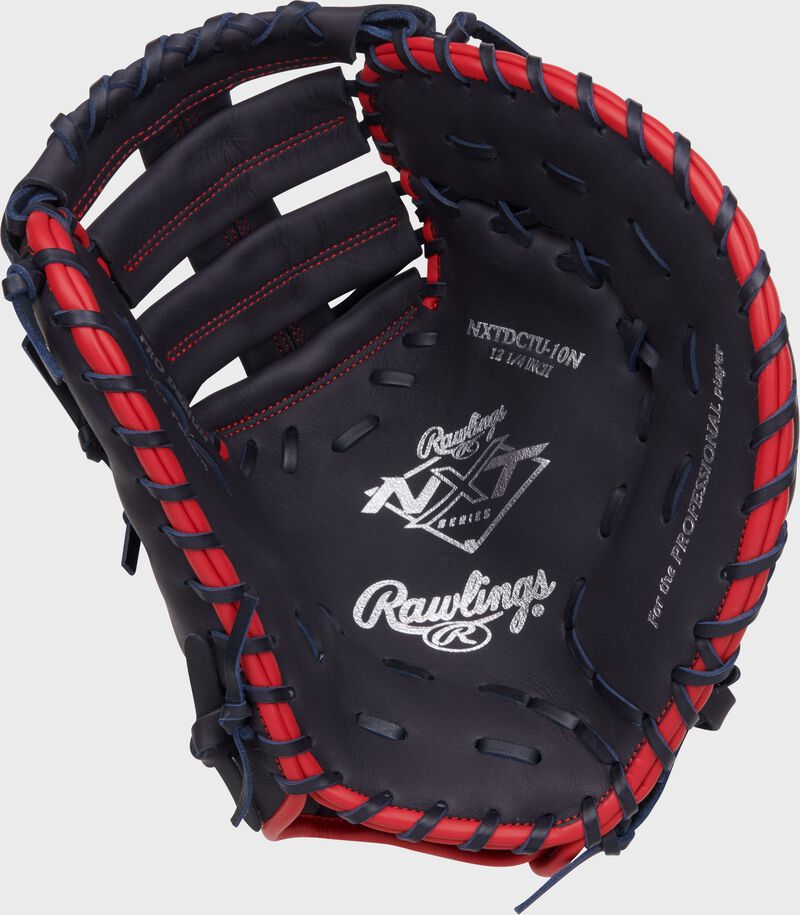 Navy palm of a Rawlings NXT Series 1st base mitt with silver stamping and navy laces