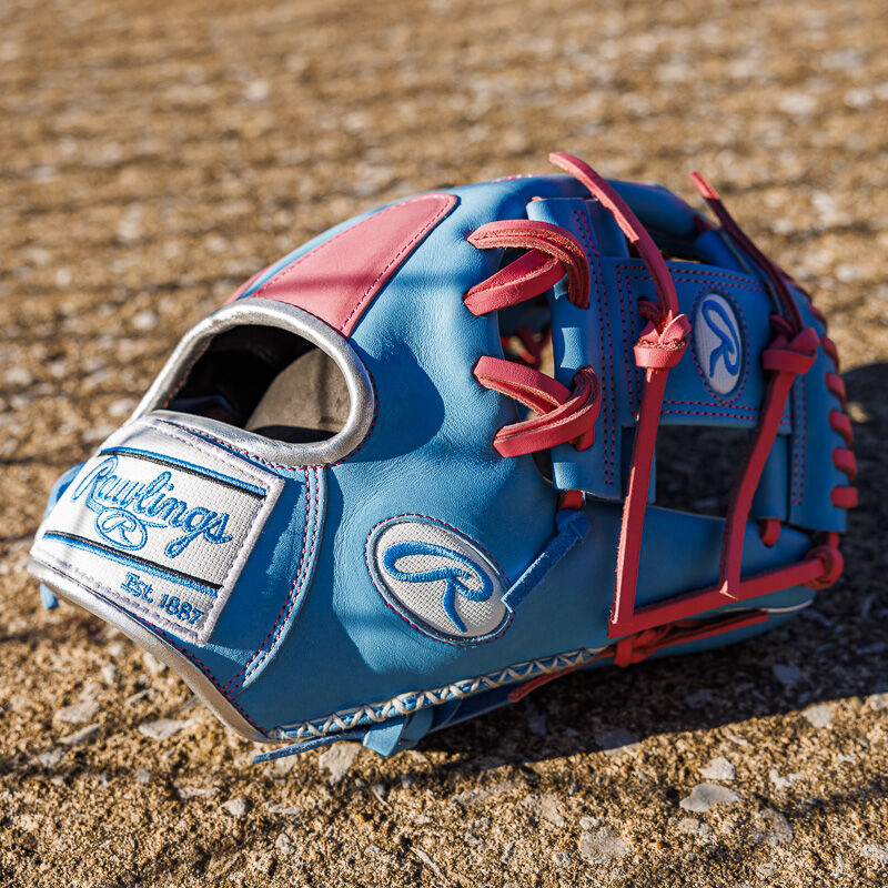 A columbia blue/pink Heart of the Hide R2G 11.5" infield glove on dirt
