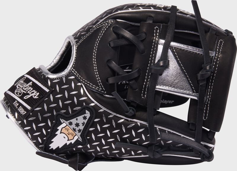 Thumb of a black Rawlings x Bettinardi Heart of the Hide 11.5-Inch Infield Glove with the Bettinardi Wizard on the thumb and a black/silver I-Web