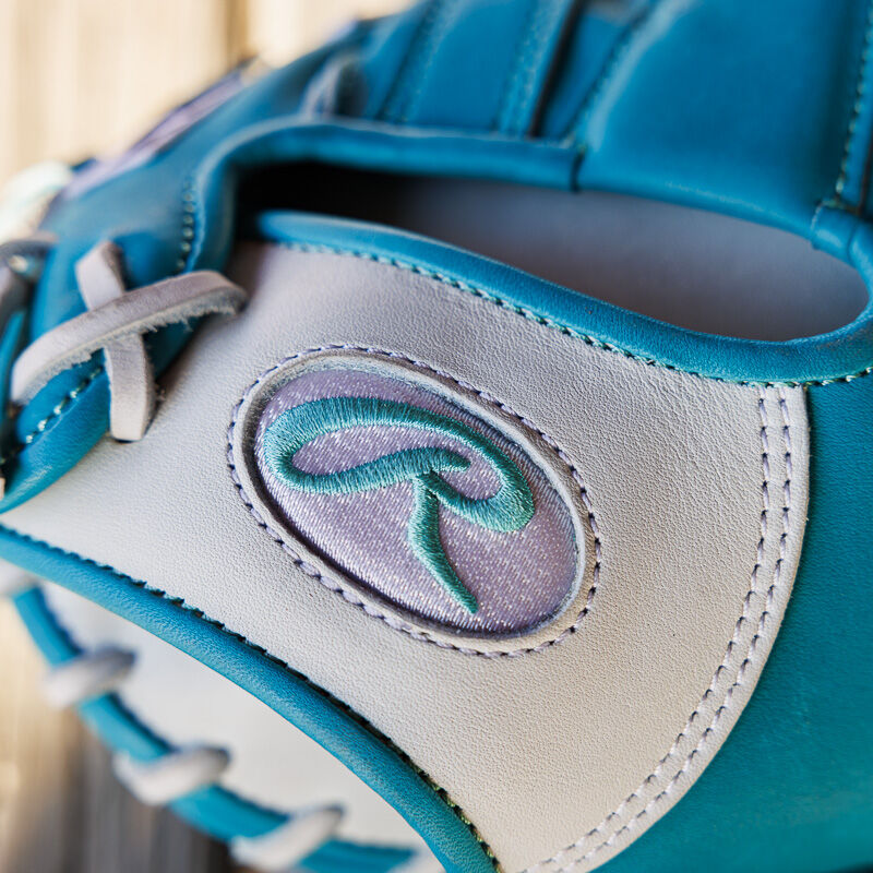 Picture of the white/teal Oval-R logo on the white wrist of an exclusive 33" Rawlings R2G Heart of the Hide catcher's mitt