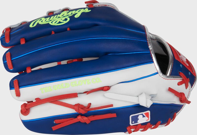 Royal blue and white back of a Heart of the Hide Luis Robert outfield glove with the MLB logo on the pinky loading=