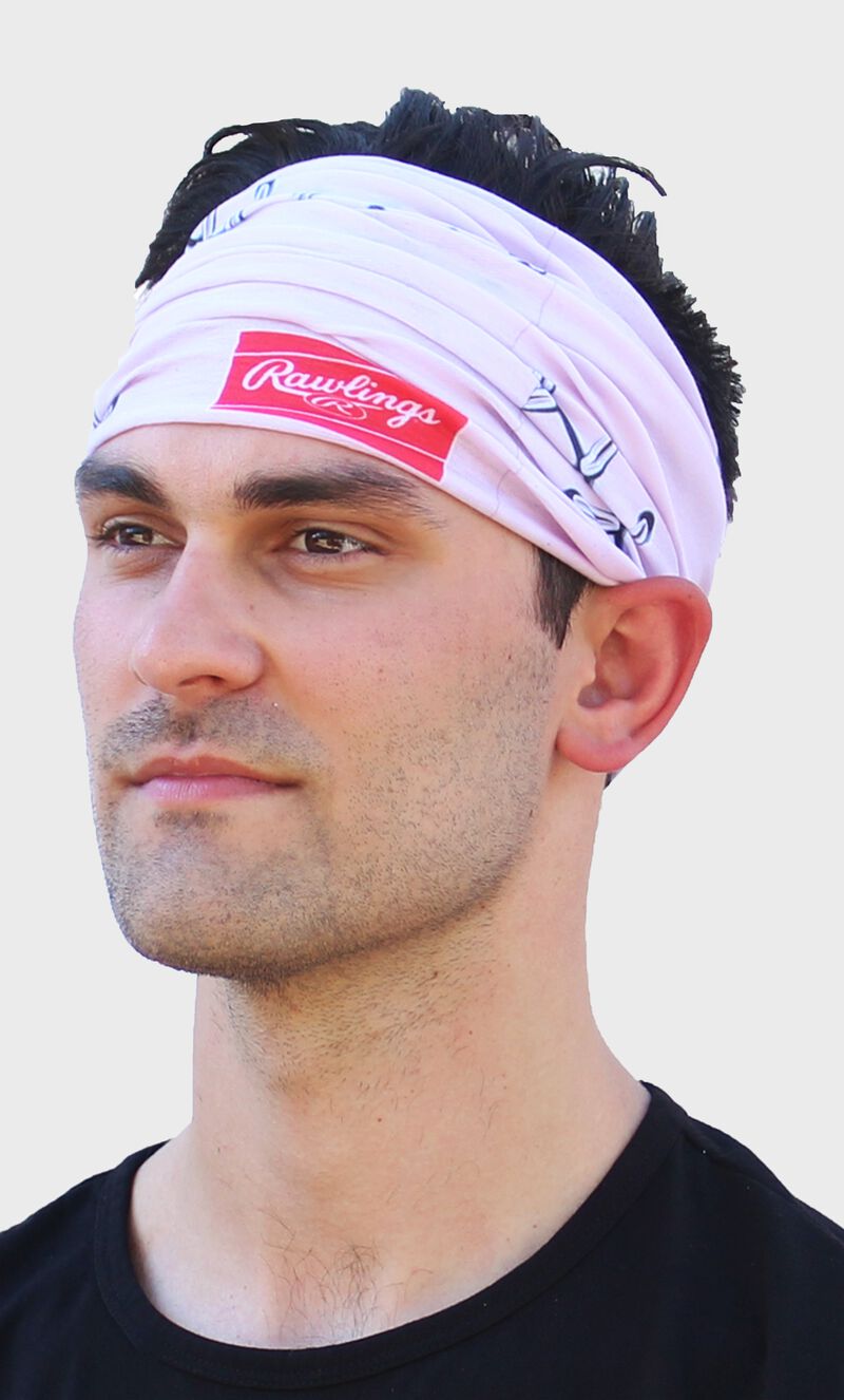 A guy wearing a pink stitch multi-functional neck gaiter as a head band - SKU: RC40001-681