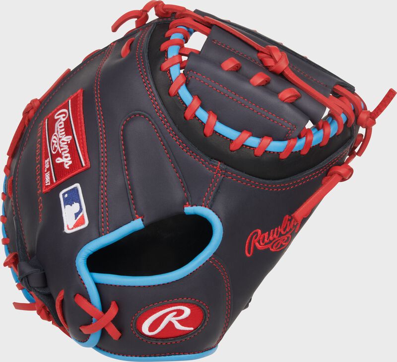 Back of a navy Rawlings NXT Series 32.5-Inch Catcher's Mitt with a red Oval-R on the wrist