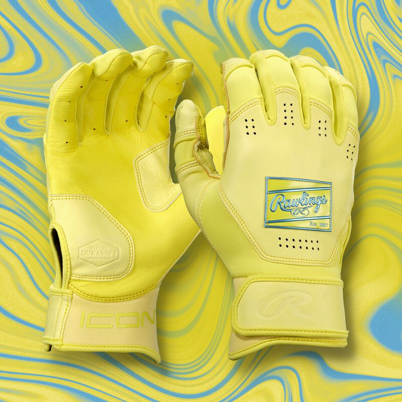 A pair of yellow Icon batting gloves with a yellow theme background