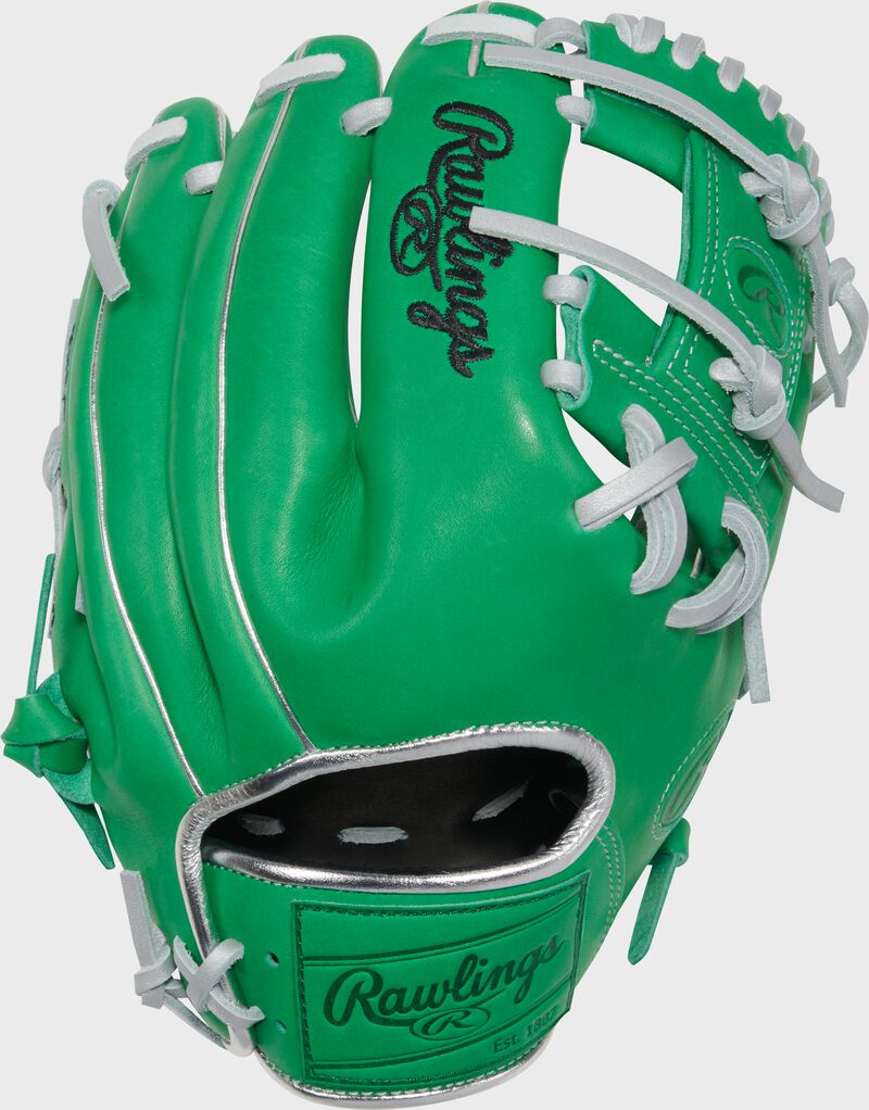 Back of a Heart of the Hide kelly green 11.5" infield glove with a kelly green leather Rawlings patch on the wrist