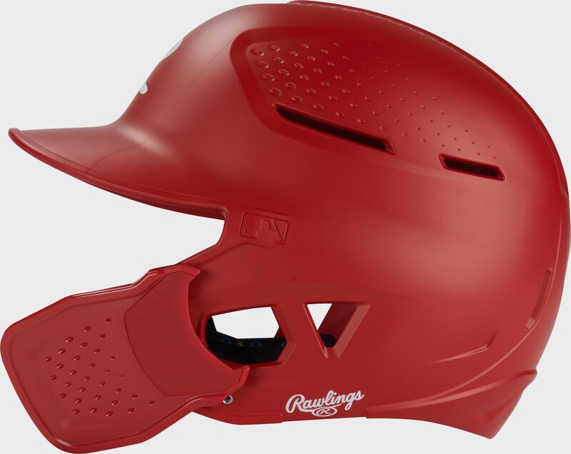 Left side of a scarlet Rawlings RX2 Reverse batting helmet
