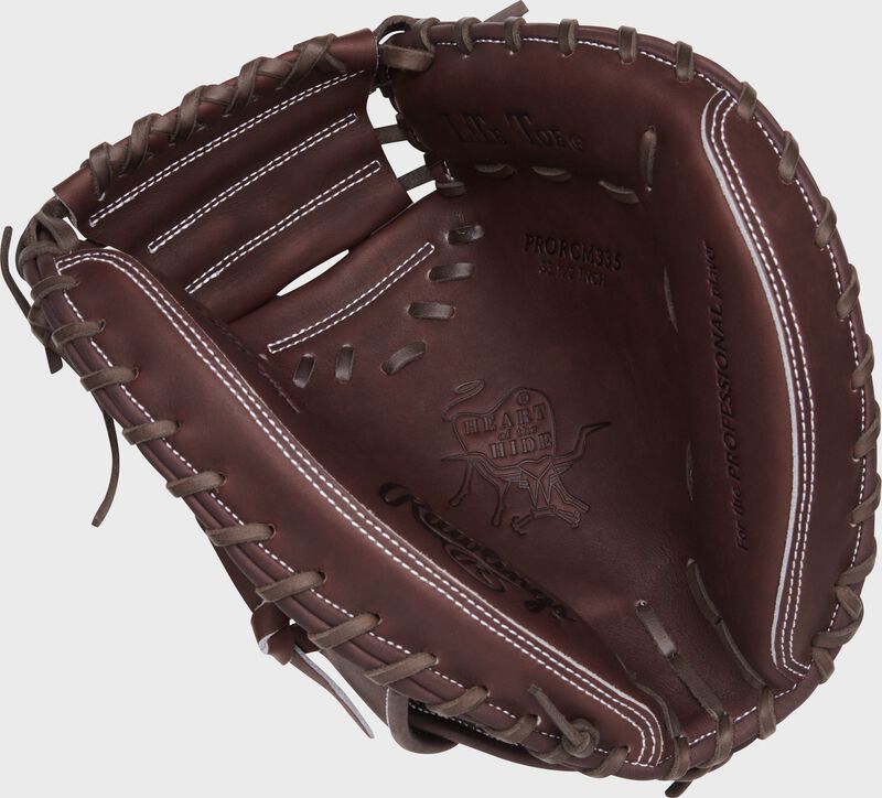 Chocolate palm of a Rawlings Heart of the Hide catcher's mitt with chocolate laces
