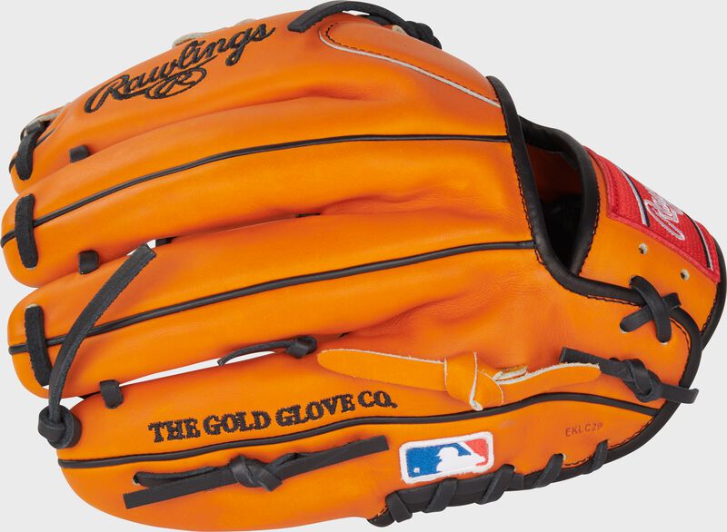 Back of an orange Jackson Holliday Heart of the Hide Infield Glove with the MLB Logo on the pinky