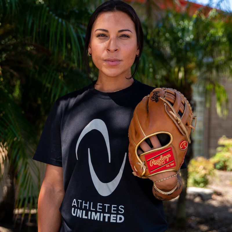 A picture of Sierra Romero in front of a tree wearing her Heart of the Hide softball glove - SKU: PROSR32