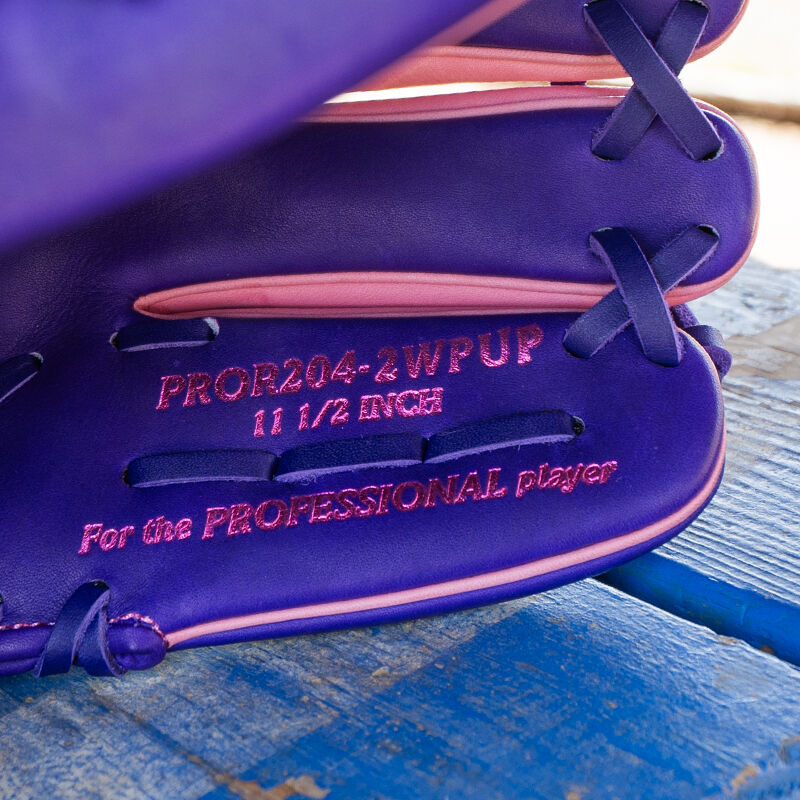 Picture of the pinky stamp on a Rawlings exclusive 11.5" R2G Heart of the Hide pink/purple infield glove