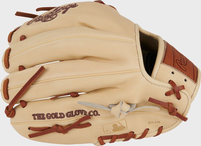 Back of a camel Heart of the Hide Hot Dog infield glove with the MLB logo on the pinky loading=