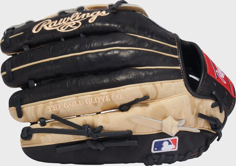Back of a black/camel Gameday 57 Series Fernando Tatís Jr. Heart of the Hide Glove with the MLB logo on the pinky loading=