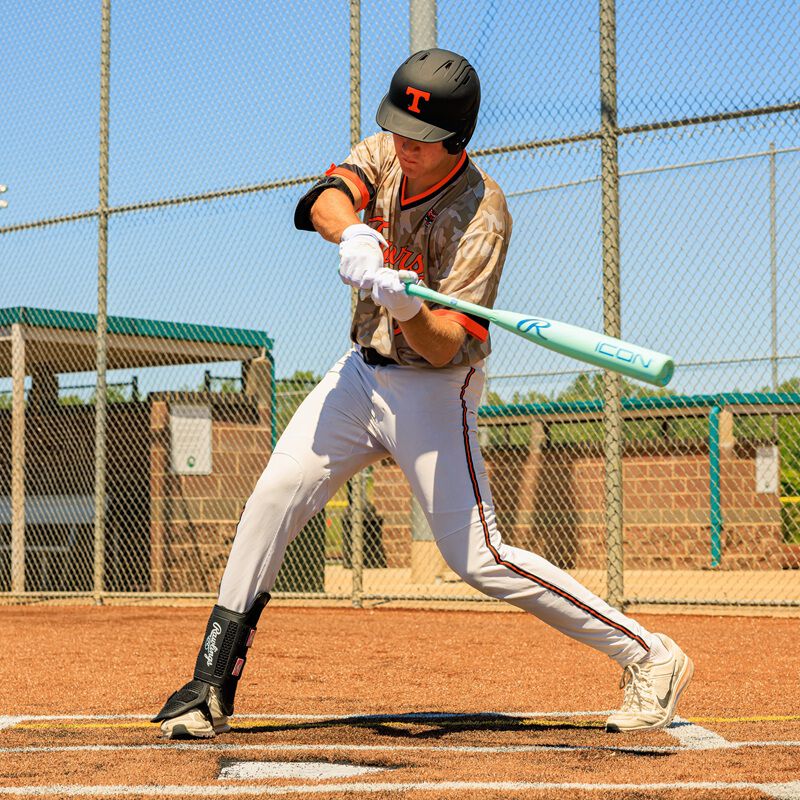 A player swinging a 2026 Rawlings Icon BBCOR bat