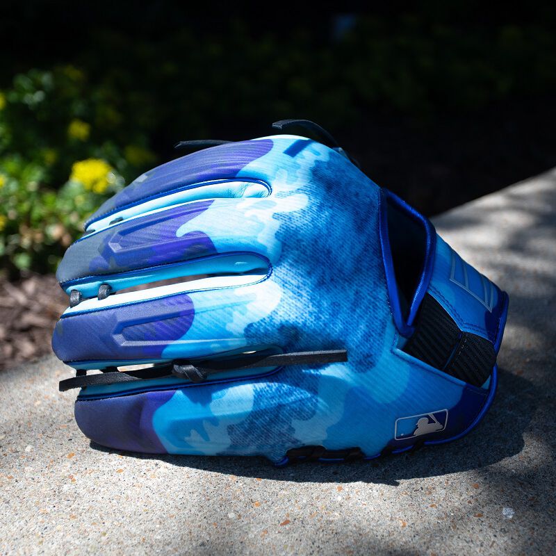 Picture of a REV1X Father's Day glove sitting on concrete
