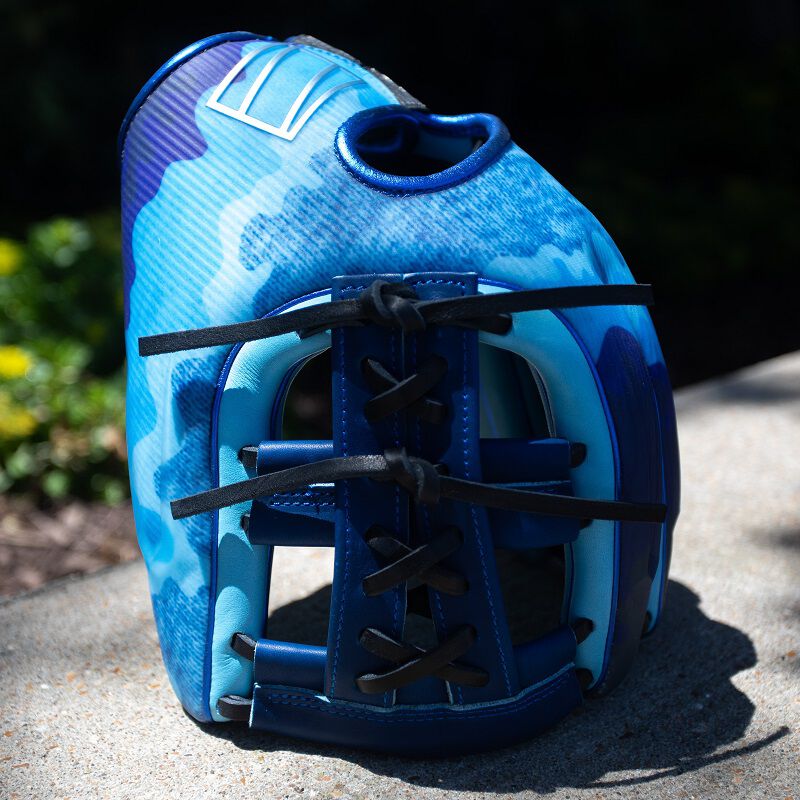 Picture of a blue Father's Day REV1X glove standing on its finger tips