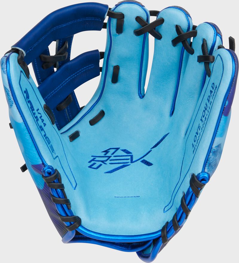 Columbia blue leather palm of a Rawlings Father's Day REV1X glove with royal laces and royal palm stamp