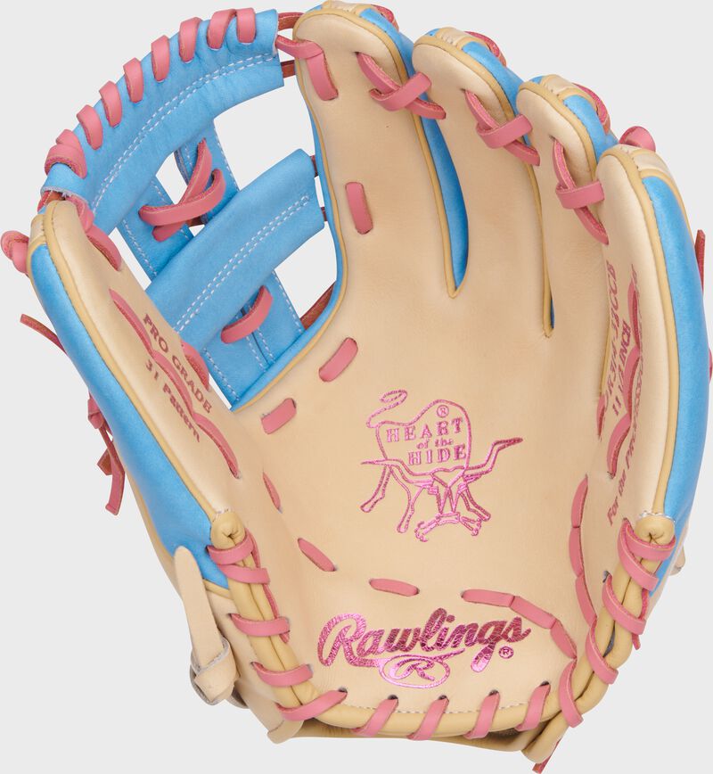 Camel palm of a Rawlings Heart of the Hide infield glove with pink stamping and pink laces