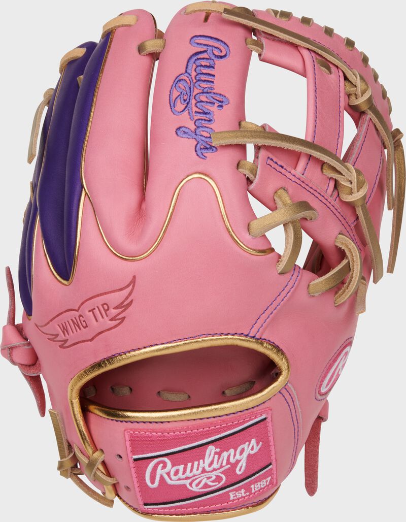 Pink Wing Tip back of a Heart of the Hide 11.5" V-web glove with a pink Rawlings patch
