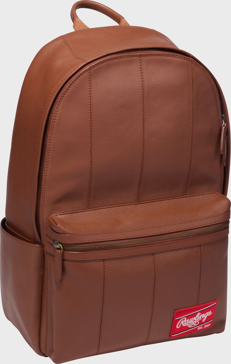 Front angle view of a tan Rawlings Strike Out backpack loading=