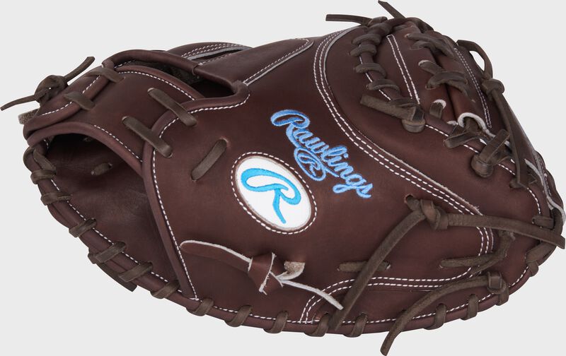 Thumb of a chocolate Heart of the Hide 33.5" catcher's mitt with a white Oval-R on the thumb