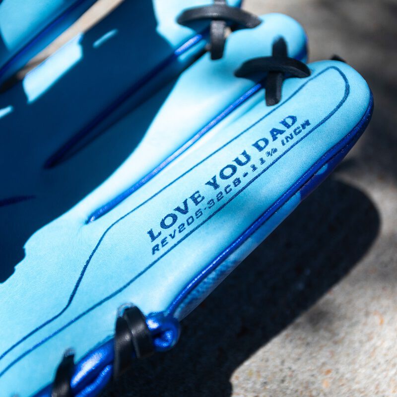 Picture of the "I Love You Dad" stamp on the pinky of a Father's Day REV1X glove