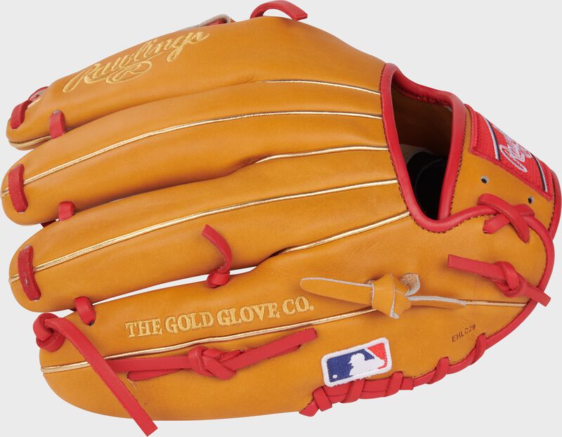 Tan back of a Jeremy Pena Heart of the Hide infield glove with the MLB logo on the pinky