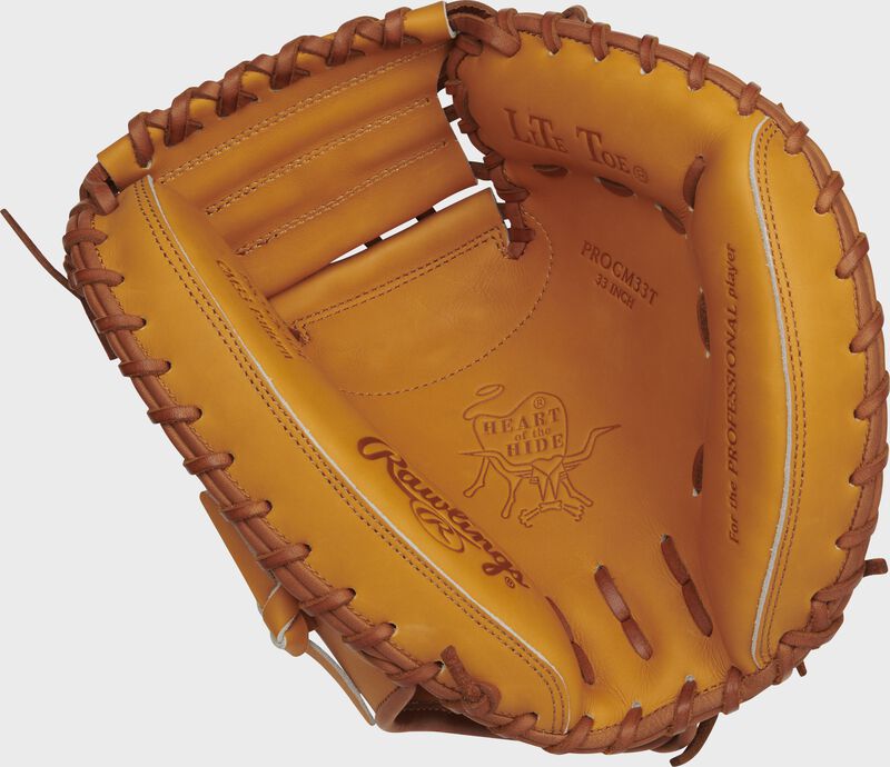 Palm of a tan Rawlings Heart of the Hide catcher's mitt with dark tan laces - SKU: PROCM33T