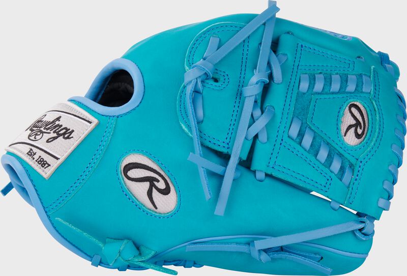 Thumb of an exclusive Heart of the Hide teal infield/pitcher's glove with a teal laced 2-piece solid web 