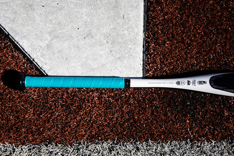 Batting grip of a Rawlings Eclipse fastpitch bat lying next to home plate - SKU: FPZE12 loading=