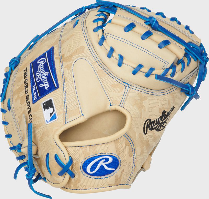 Back of a camel Heart of the Hide ContoUR Fit 32.5-Inch Catcher's Mitt with a royal Oval-R logo on the wrist
