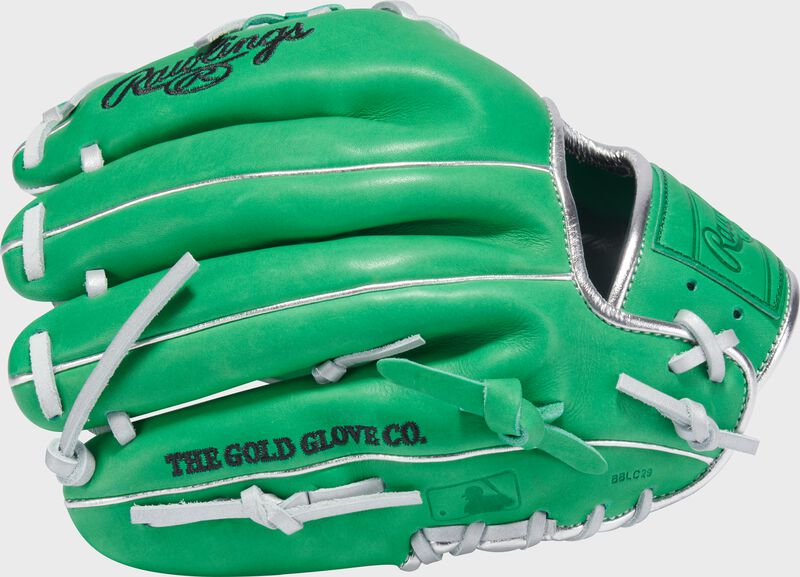 Back of a Heart of the Hide kelly green 11.5" infield glove with the MLB logo on the pinky
