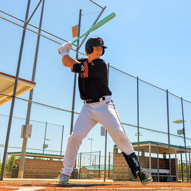 A player batting with a 2026 Rawlings Icon BBCOR bat