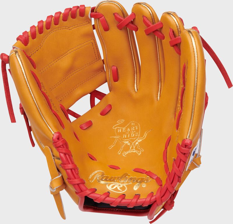 Tan palm of a Rawlings Jeremy Pena Heart of the Hide infield glove with scarlet laces