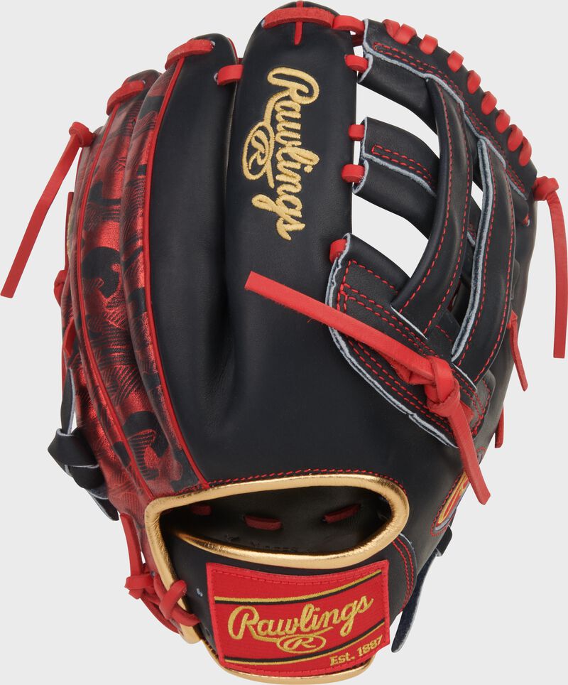Back of a navy/scarlet Nolan Arenado Heart of the Hide 12-Inch Infield Glove with a red Rawlings patch