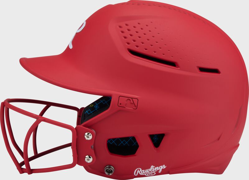 Left side of a scarlet Rawlings RX2 fastpitch batting helmet