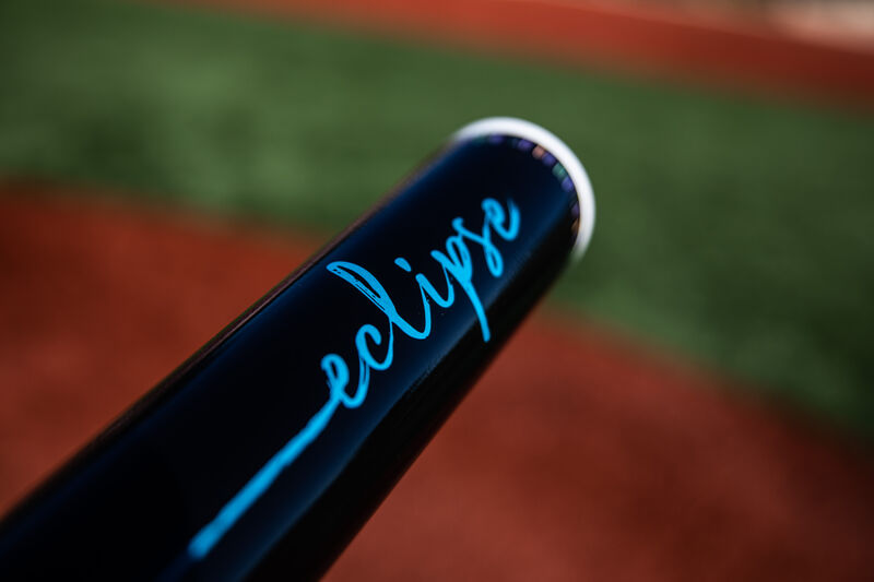 Black barrel of a 2020 Eclipse fastpitch bat with a field in the background - SKU: FPZE12 loading=
