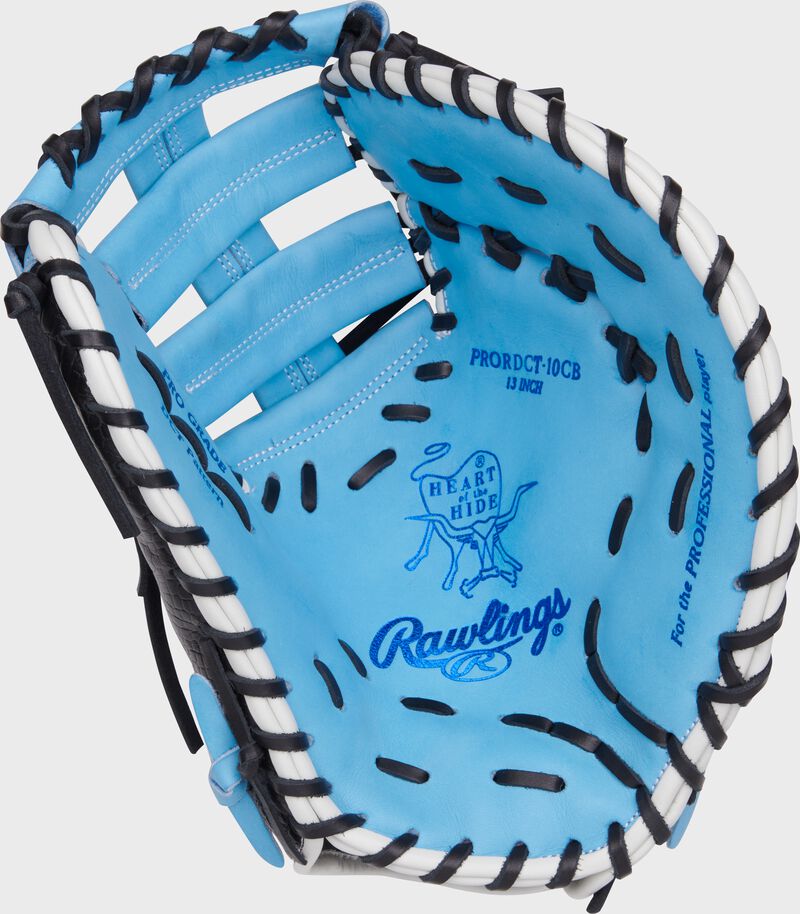 Columbia blue palm of a Rawlings Heart of the Hide first base mitt with royal stamping and black laces