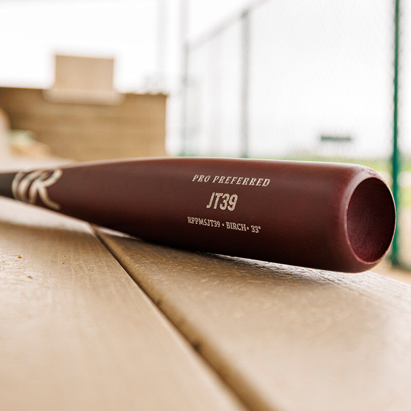 Maroon barrel of a Pro Preferred JT39 Torpedo barrel birch wood bat on a bench loading=