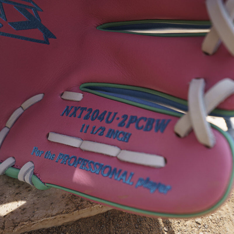 Columbia blue pinky stamp on the pink leather of an Exclusive Rawlings NXT Series 11.5" Infield Glove loading=