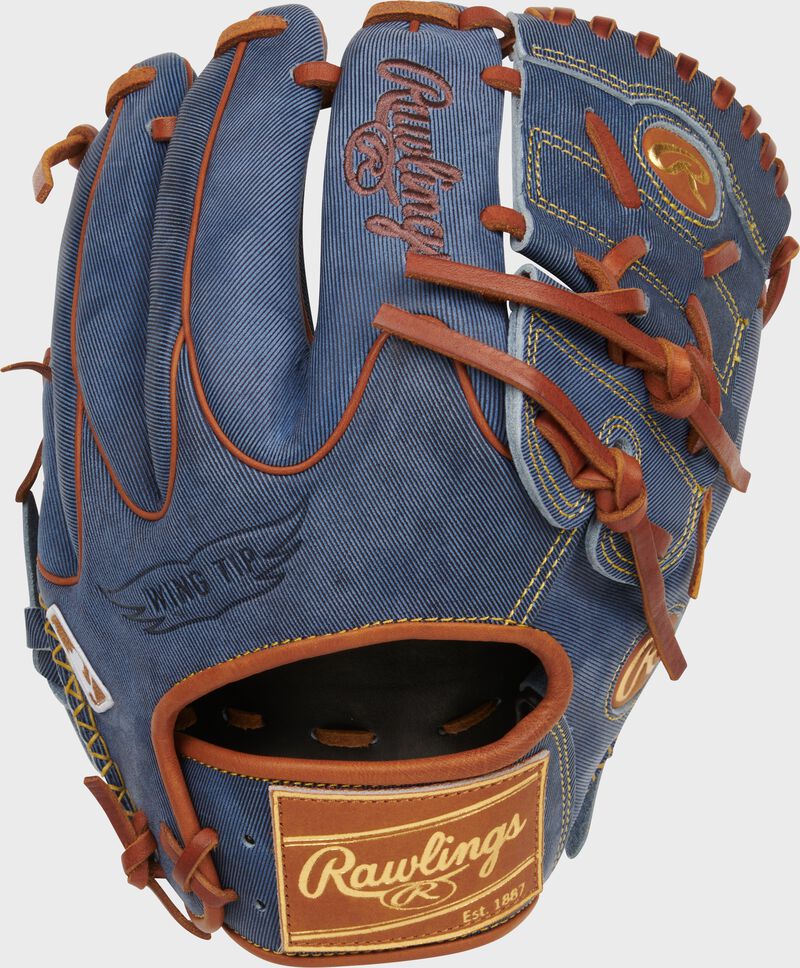 Back of a Heart of the Hide Pro Label Denim Infield/Pitcher's Glove with a tan leather Rawlings patch