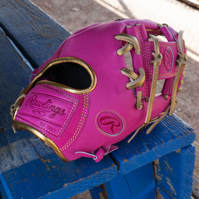 Picture of an Exclusive 11.5" R2G Heart of the Hide Berry infield glove on a table