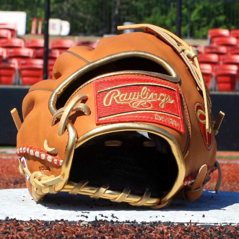 Rawlings patch on the wrist of a Sierra Romero HOH fastpitch glove sitting on home plate on a field - SKU: PROSR32