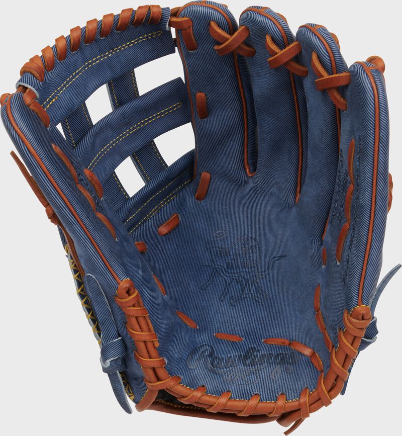 Palm of a Rawlings Heart of the Hide Pro Label Denim outfield glove with tan laces