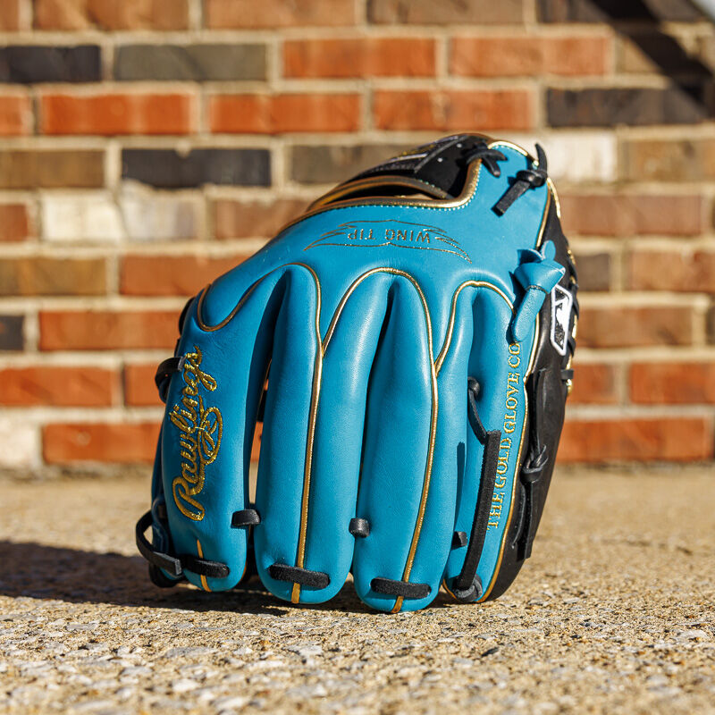 Picture of a teal/black Exclusive 11.5" Rawlings R2G Heart of the Hide infield glove standing on its fingers
